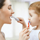 Demonstrating proper dental care for children's teeth